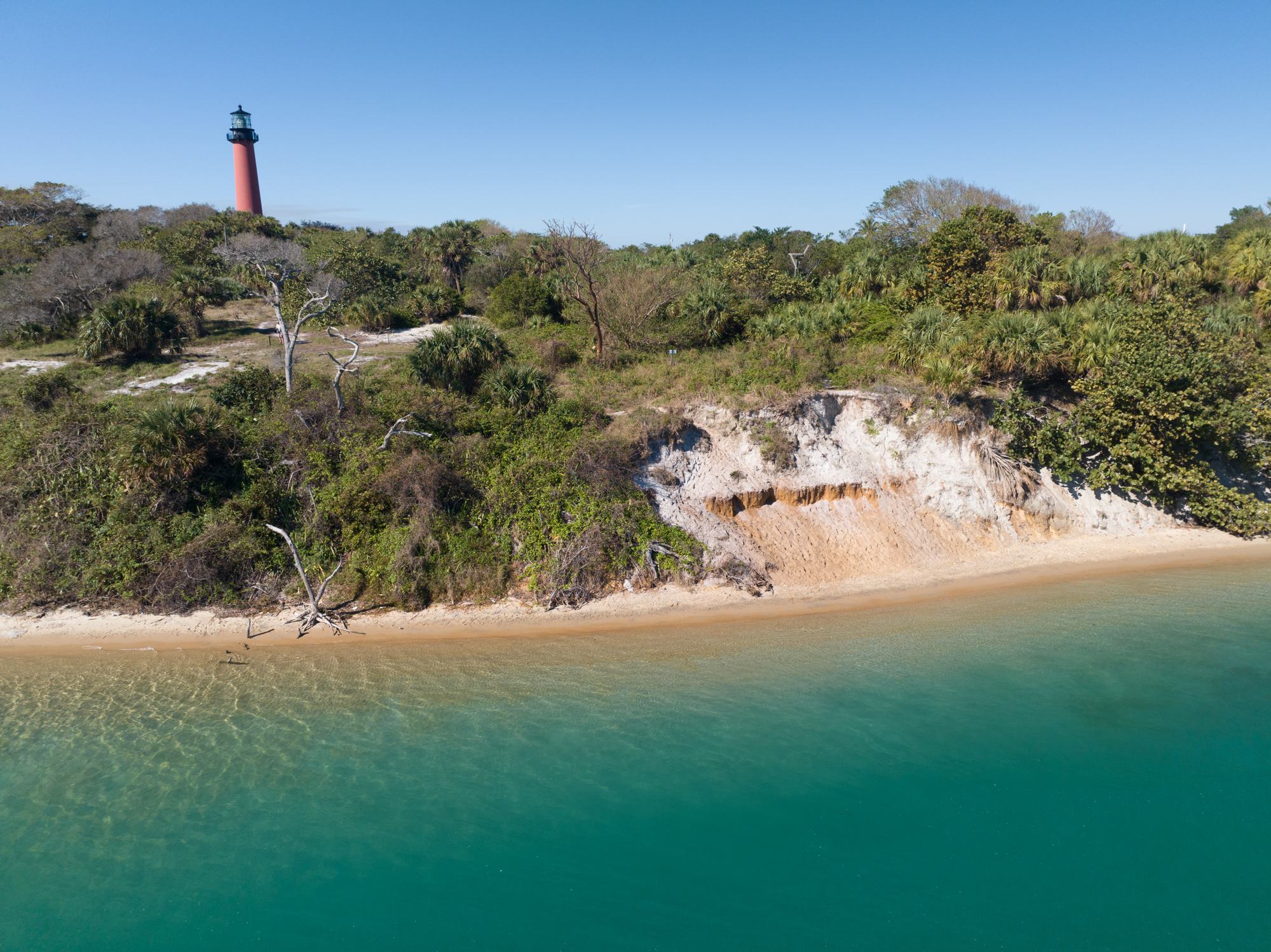 The lighthouse over the inlet beach